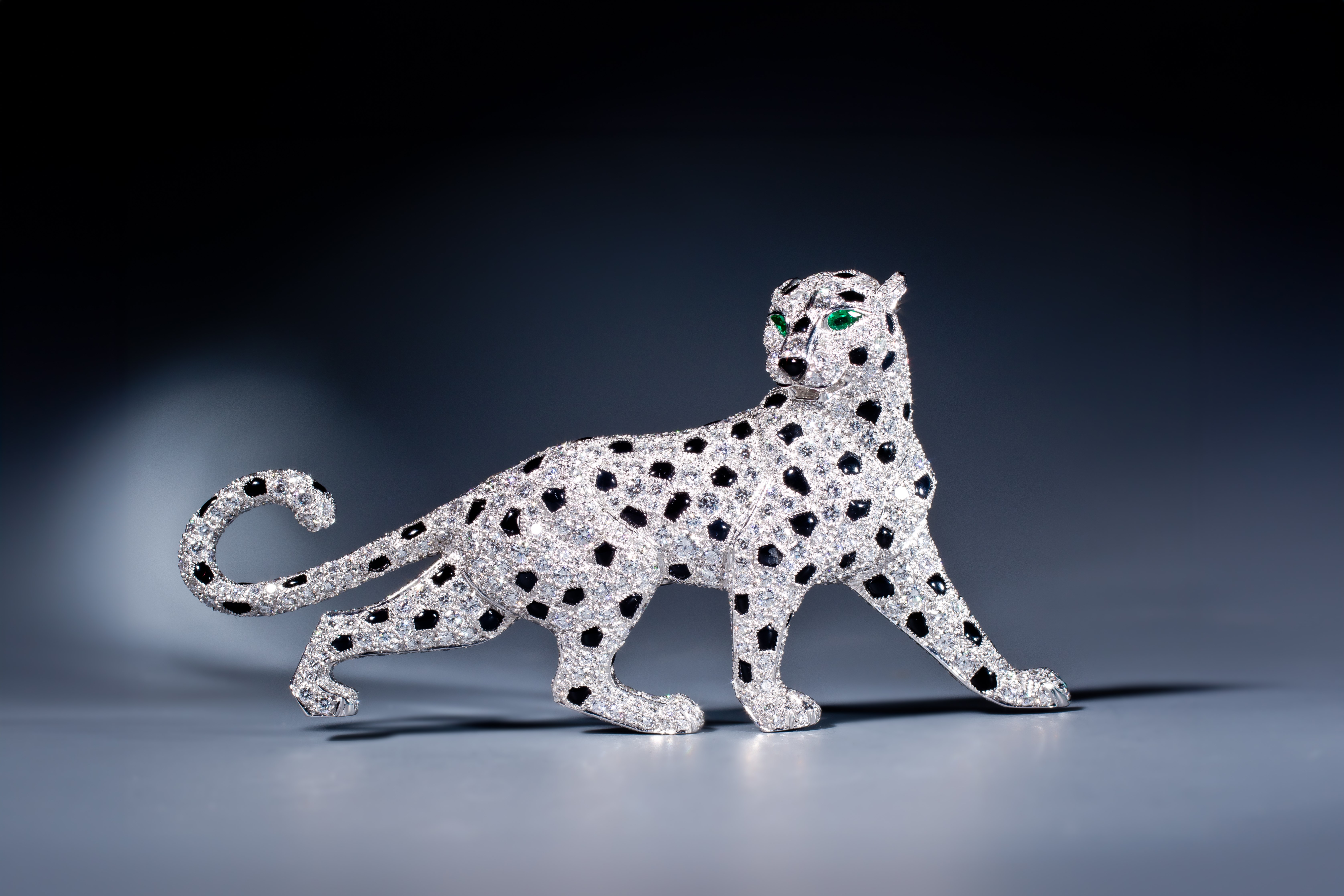 A graceful, strolling panther brooch by Cartier