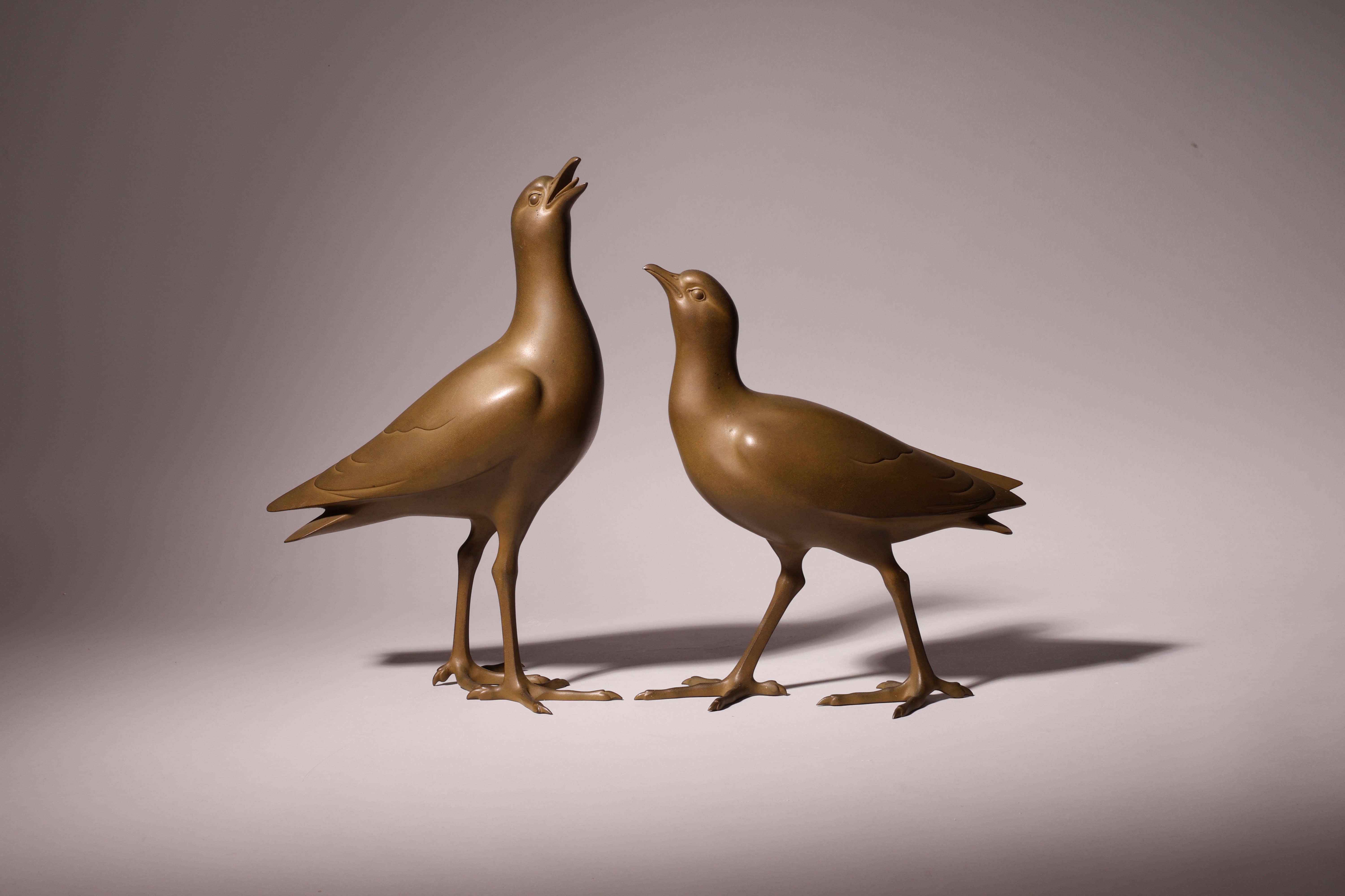 Pair of Bronze Plovers by Tsuda Shinobu (1875-1946)