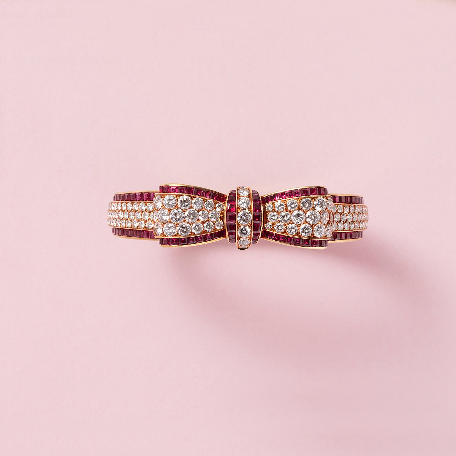 Gold VCA bow bracelet with diamond and ruby